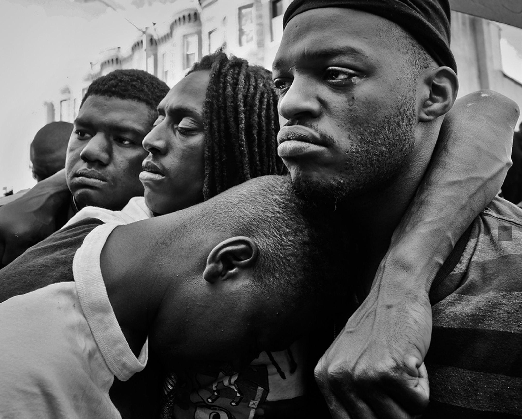 Young African men standing together in community
